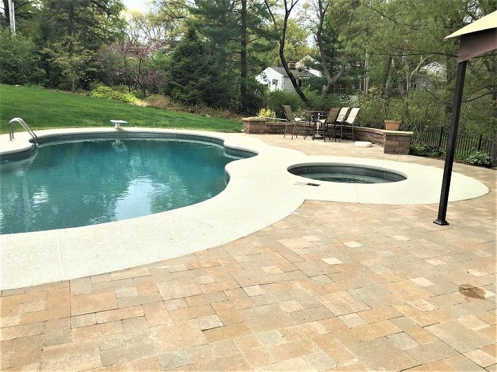 Professional technician sealing pool surface cracks to prevent ongoing water loss.