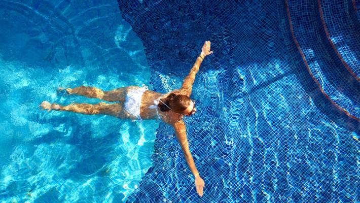 Palm Beach Pool & Spa Services repair expert working on pool