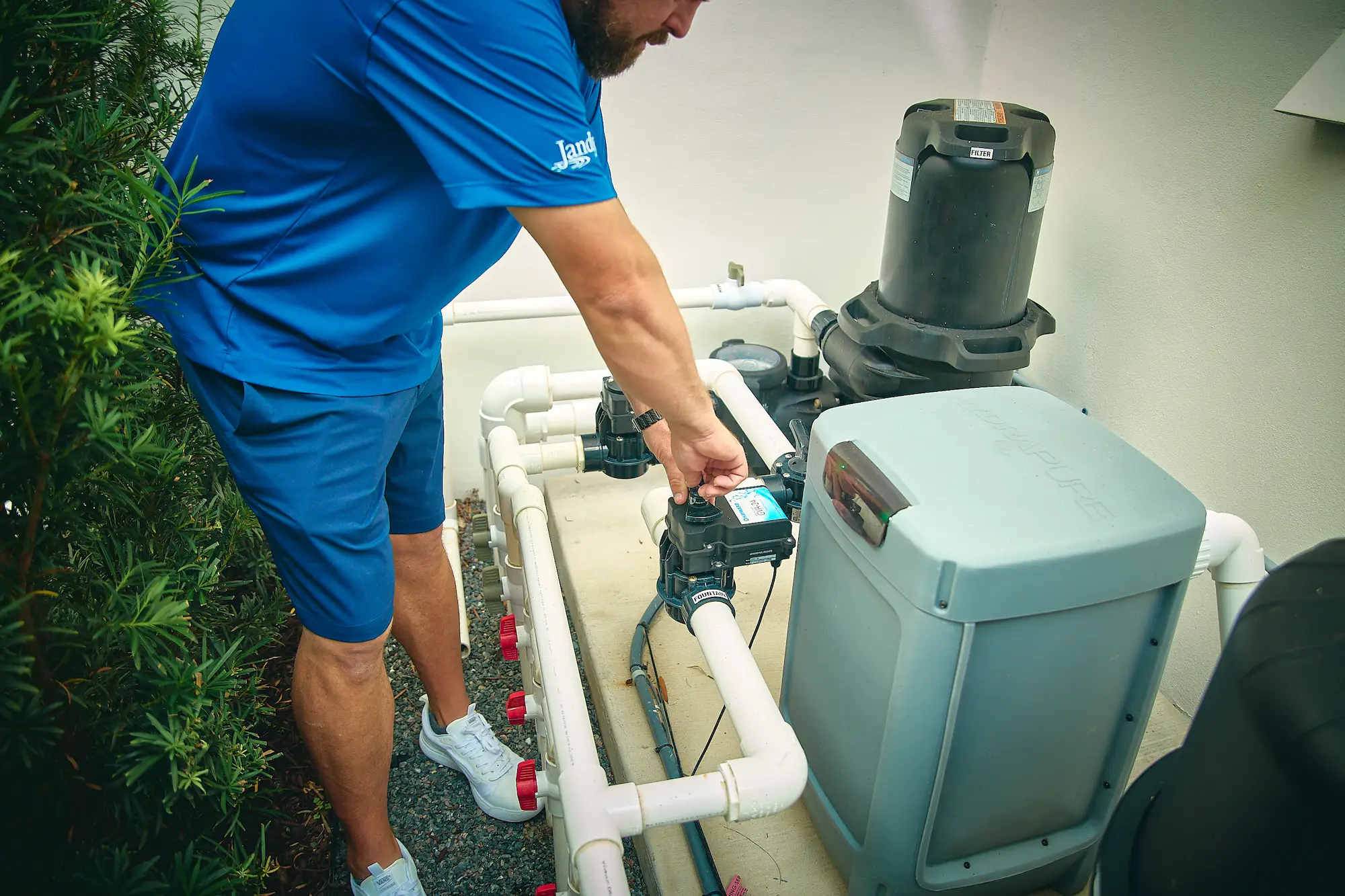 expert repairing the pool pump