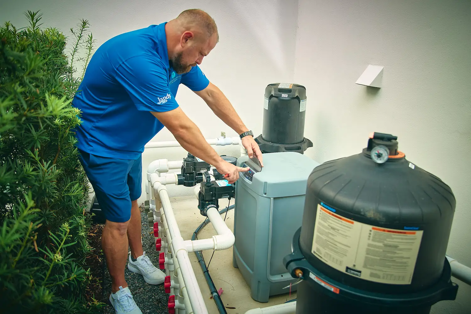 Professional doing the pool heater tune up