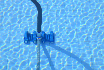 Professional swimming pool repair experts fixing pool tiles in Palm Beach