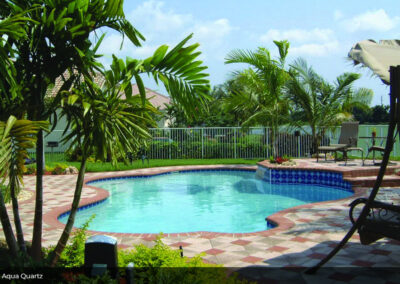 Professional swimming pool repair experts fixing pool tiles in Palm Beach
