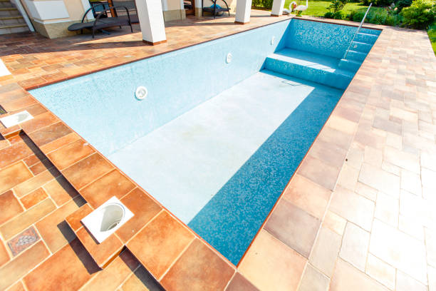 Skilled resurfacing specialist using advanced tools on pool in Wellington to ensure lasting, reliable results