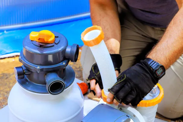Technician evaluating pool equipment condition for repair or replacement in West Palm Beach, FL. Pool Equipment repair near me
